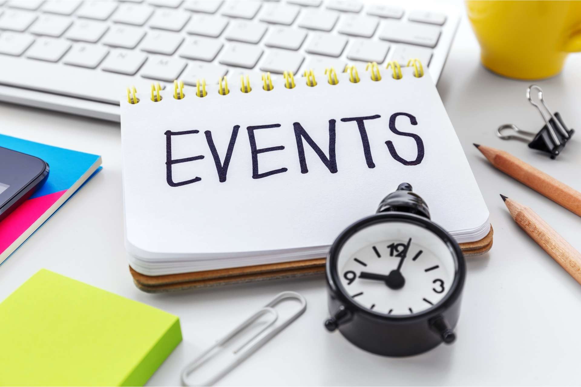 Corporate team reviewing an event planning checklist during a meeting