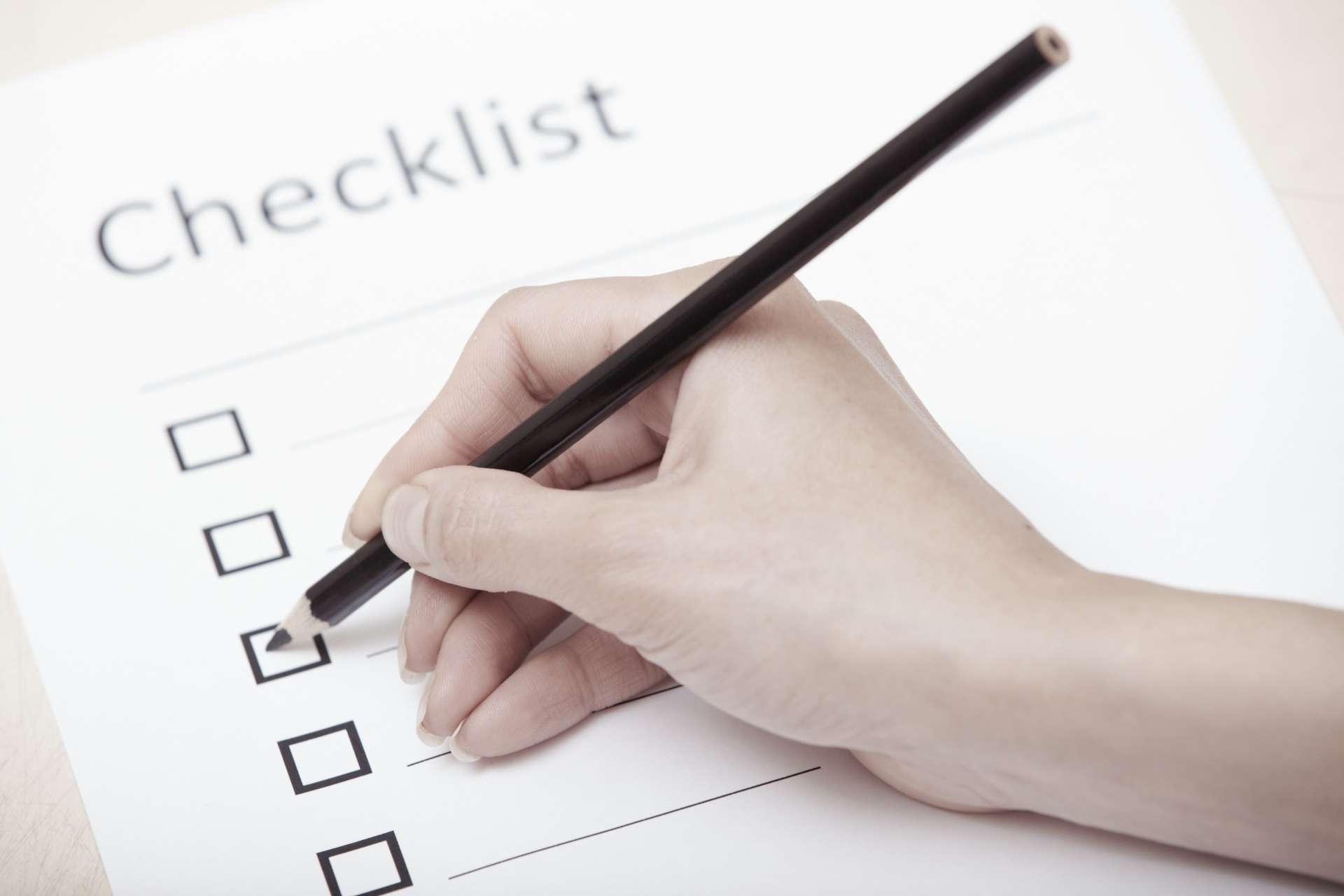 Event planner checking the venue layout as part of the event checklist